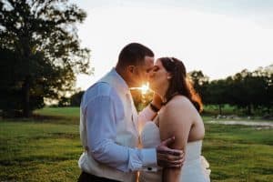 KG Photography and videography couple kissing at sunset
