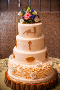 Edible Art ruffle wedding cake designed with unique symbols of birds and keys