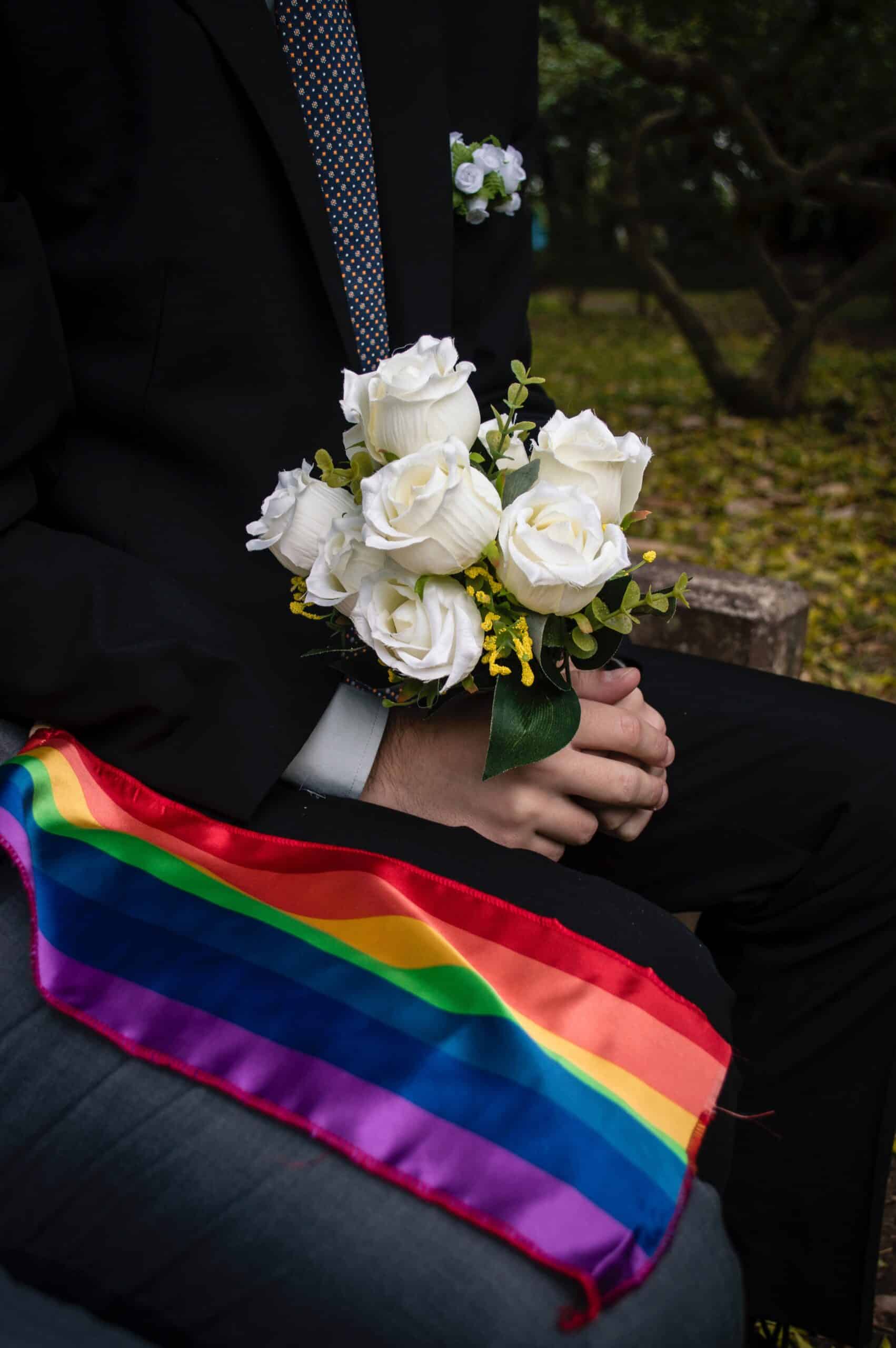 Pride flag next to wedding bouquet 